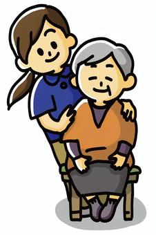 介護士２ 介護,高齢者,座る,さする,微笑むのイラスト素材