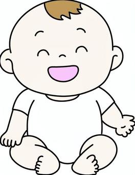 お座りをしている笑顔の赤ちゃん