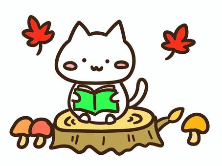 秋に切り株で読書を楽しむかわいい白ねこ 秋,切り株,読書のイラスト素材