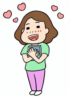 推しのCDを抱きしめて幸せを感じる女性 推し活,推し,グッズ,cd,幸せ,嬉しい,喜び,満足,感動,感情のイラスト素材