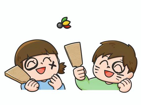 羽子板で遊ぶ子ども