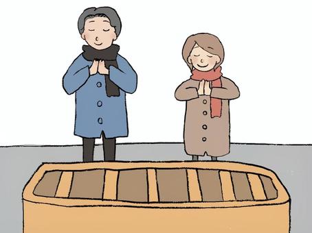 神社に参拝する夫婦