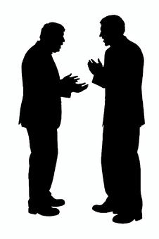 話し合うビジネスマンのシルエット