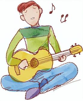 ギターを弾く少年
