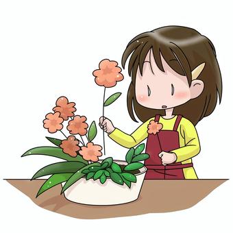 フラワーアレンジメントをする女性