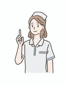 指を立てる女性ナース