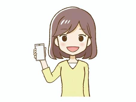 笑顔でスマホを持つ黄色い服の女性（上半身 笑顔,女,黄色,服,私服,携帯,電話,スマートフォン,デジタル,スマホのイラスト素材