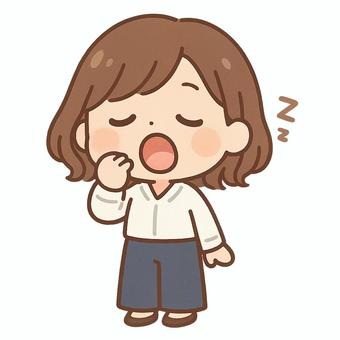 睡眠不足であくびをしている女性