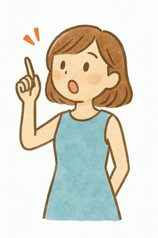 左上を指差す女性