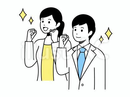 上を見上げてガッツポーズをする男女会社員