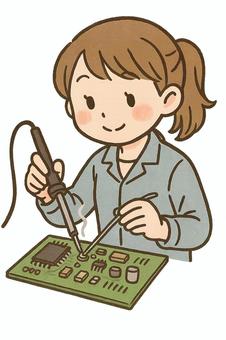 はんだ付けをする女性