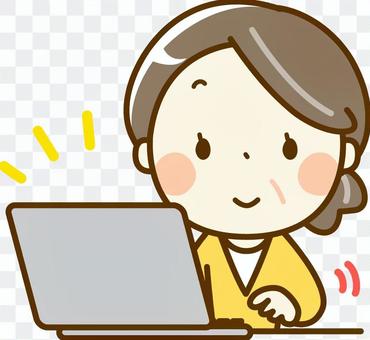 Senior woman operating a personal computer Senior woman operating a personal computer