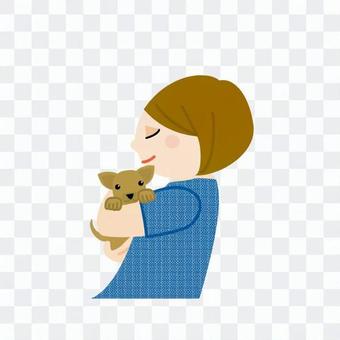A woman holding a dog A woman holding a dog