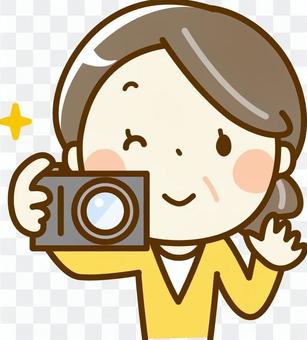 Senior woman holding a camera Senior woman holding a camera