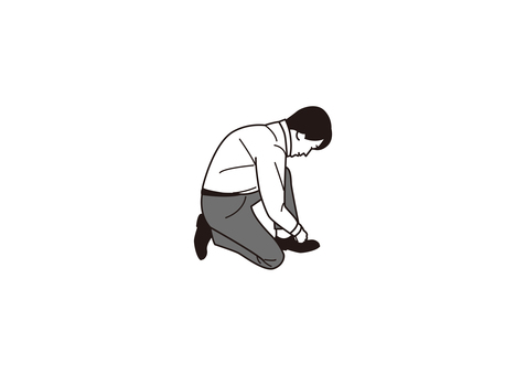 A businessman tying shoelaces A businessman tying shoelaces
