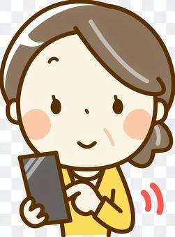 Senior woman operating a smartphone Senior woman operating a smartphone