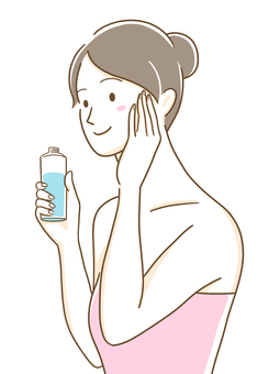 Woman putting on lotion Woman putting on lotion