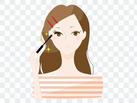 A woman applying mascara A woman applying mascara