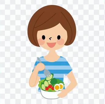 A woman eating a salad A woman eating a salad