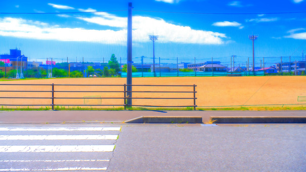Road and baseball field Road and baseball field