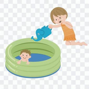 Children playing in a plastic pool Children playing in a plastic pool