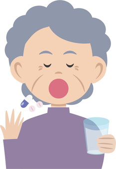Elderly woman taking medicine Elderly woman taking medicine