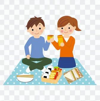 A couple enjoying a picnic A couple enjoying a picnic