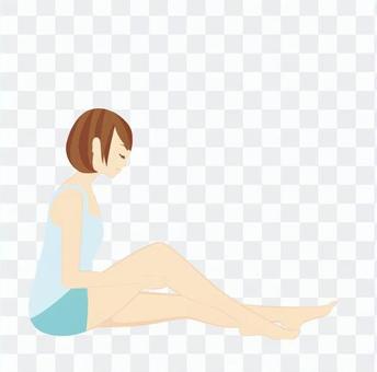 A woman sitting with one knee upright A woman sitting with one knee upright