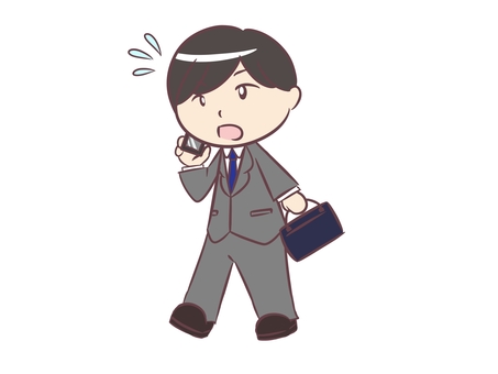 A businessman walking while making a phone call A businessman walking while making a phone call
