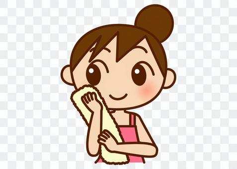 A woman wiping his face with a towel A woman wiping his face with a towel