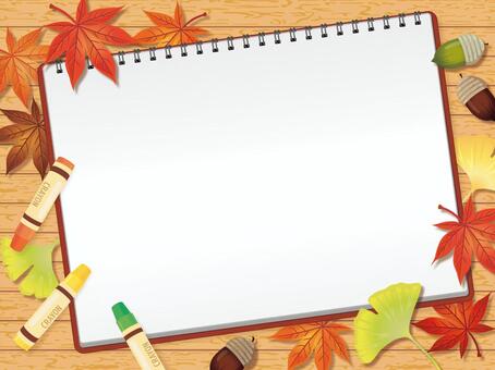Sketchbook with crayons and fallen leaves background A Sketchbook with crayons and fallen leaves background A