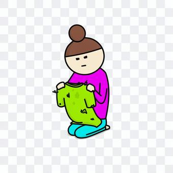 Woman staring at old clothes Woman staring at old clothes