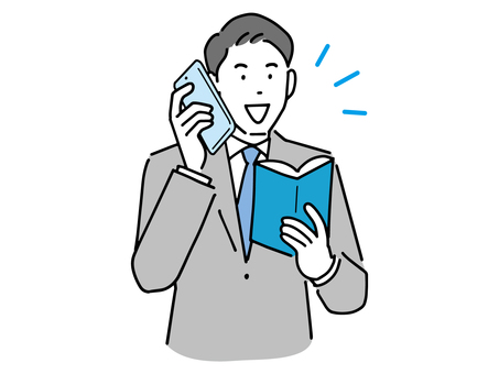A businessman who holds a notebook and talks on a smartphone A businessman who holds a notebook and talks on a smartphone