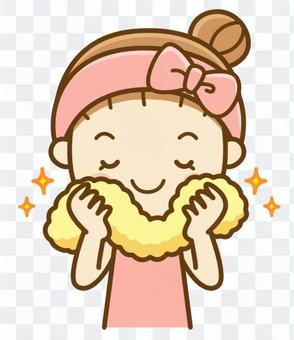A woman wiping his face with a towel A woman wiping his face with a towel