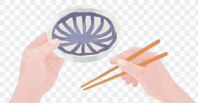 Hand holding bowl and chopsticks Hand holding bowl and chopsticks